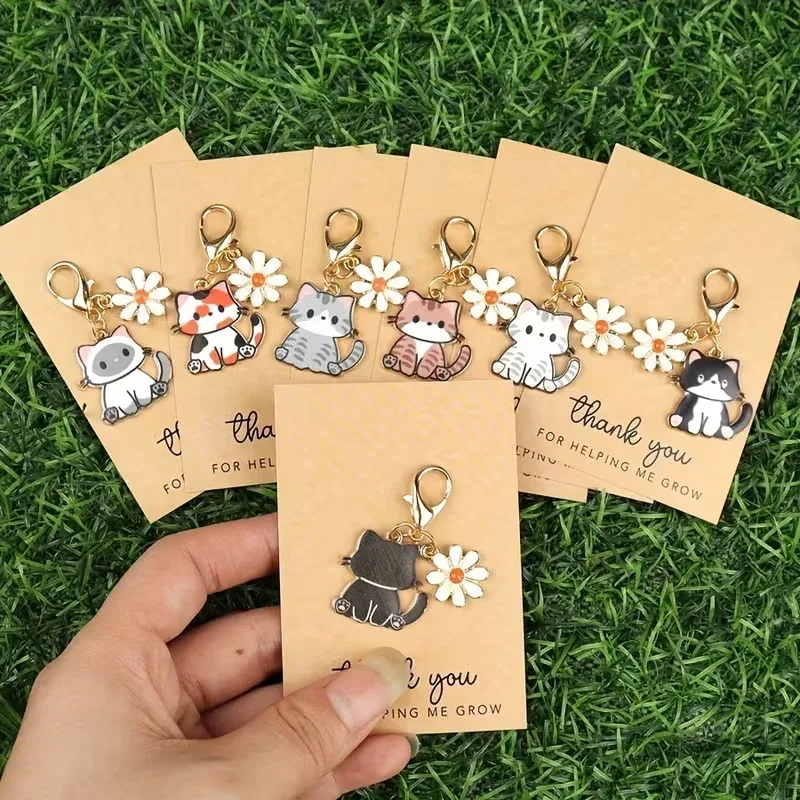 Conjunto de chaveiros com gatos e flores
