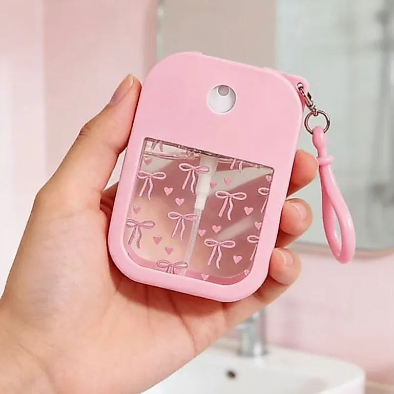 Frasco spray portátil rosa recarregável
